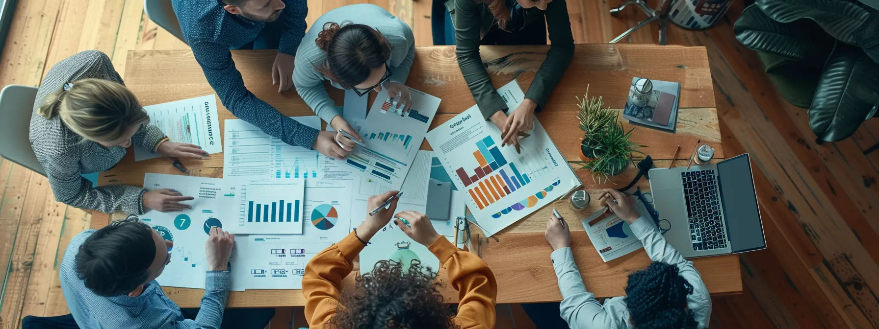 a group of marketing professionals brainstorming strategies around a table filled with charts and graphs.